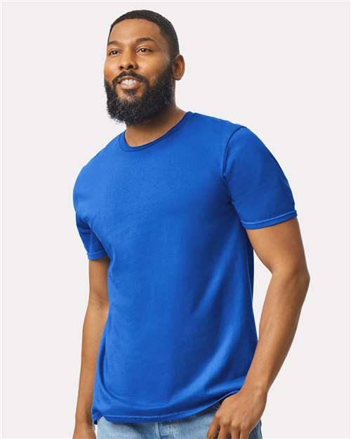 Model wearing a Gildan 64000 Softstyle T-shirt in Royal, front view.