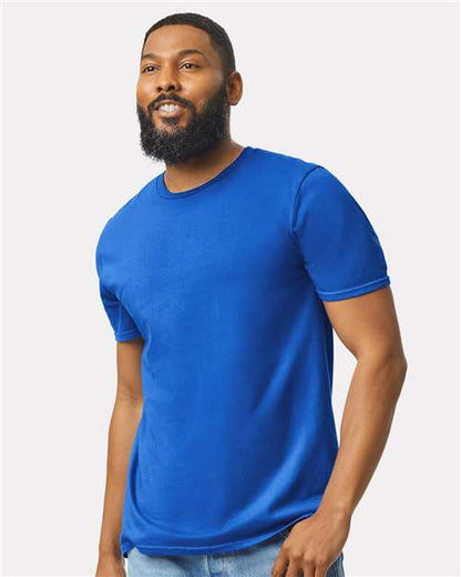 Model wearing a Gildan 64000 Softstyle T-shirt in Royal, front view.