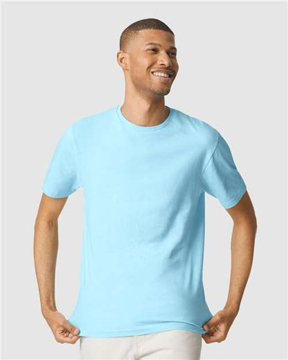 Model wearing a Gildan 64000 Softstyle T-shirt in Sky, front view.