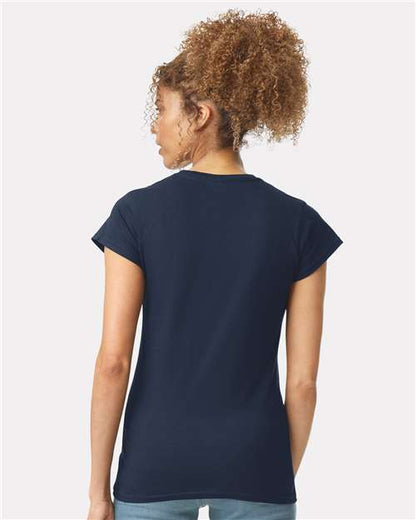 Model wearing a Gildan 64000L Softstyle women's T-shirt in Navy, back view.