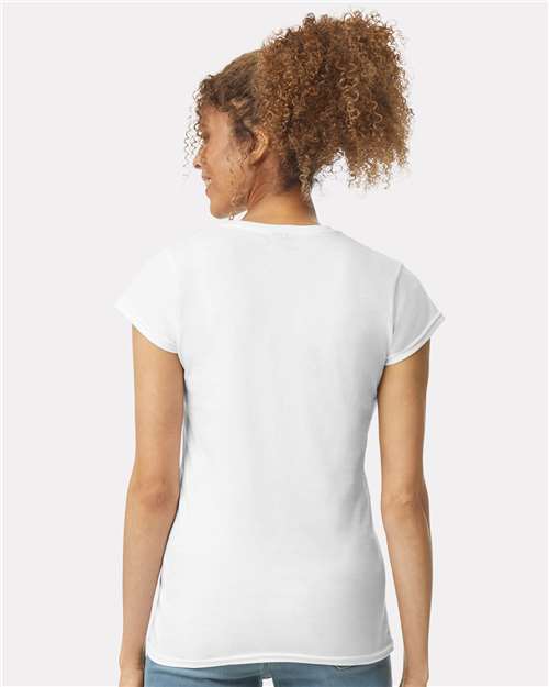 Model wearing a Gildan 64000L Softstyle women's T-shirt in White, back view.