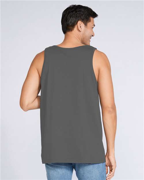 Model wearing a Gildan 64200 Softstyle men's tank top in Charcoal, back view.