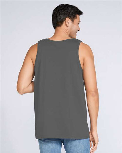 Model wearing a Gildan 64200 Softstyle men's tank top in Charcoal, back view.