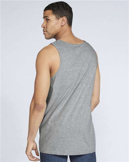 Model wearing a Gildan 64200 Softstyle men's tank top in Sport Grey, back view.