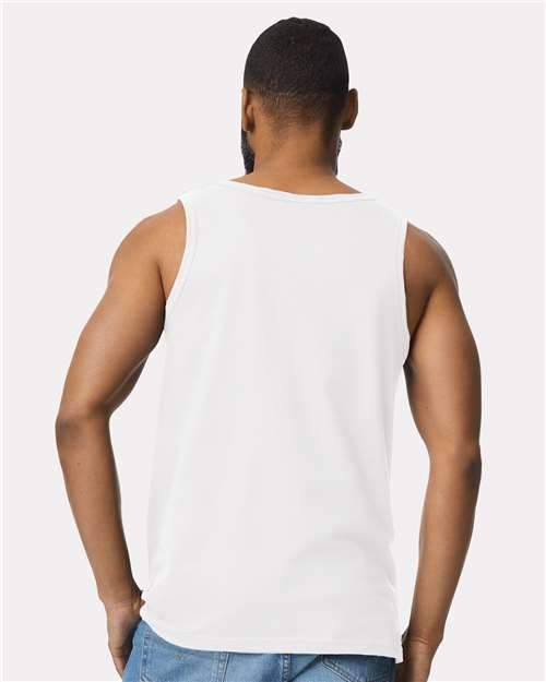 Model wearing a Gildan 64200 Softstyle men's tank top in White, back view.