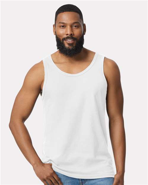 Model wearing a Gildan 64200 Softstyle men's tank top in White, front view.