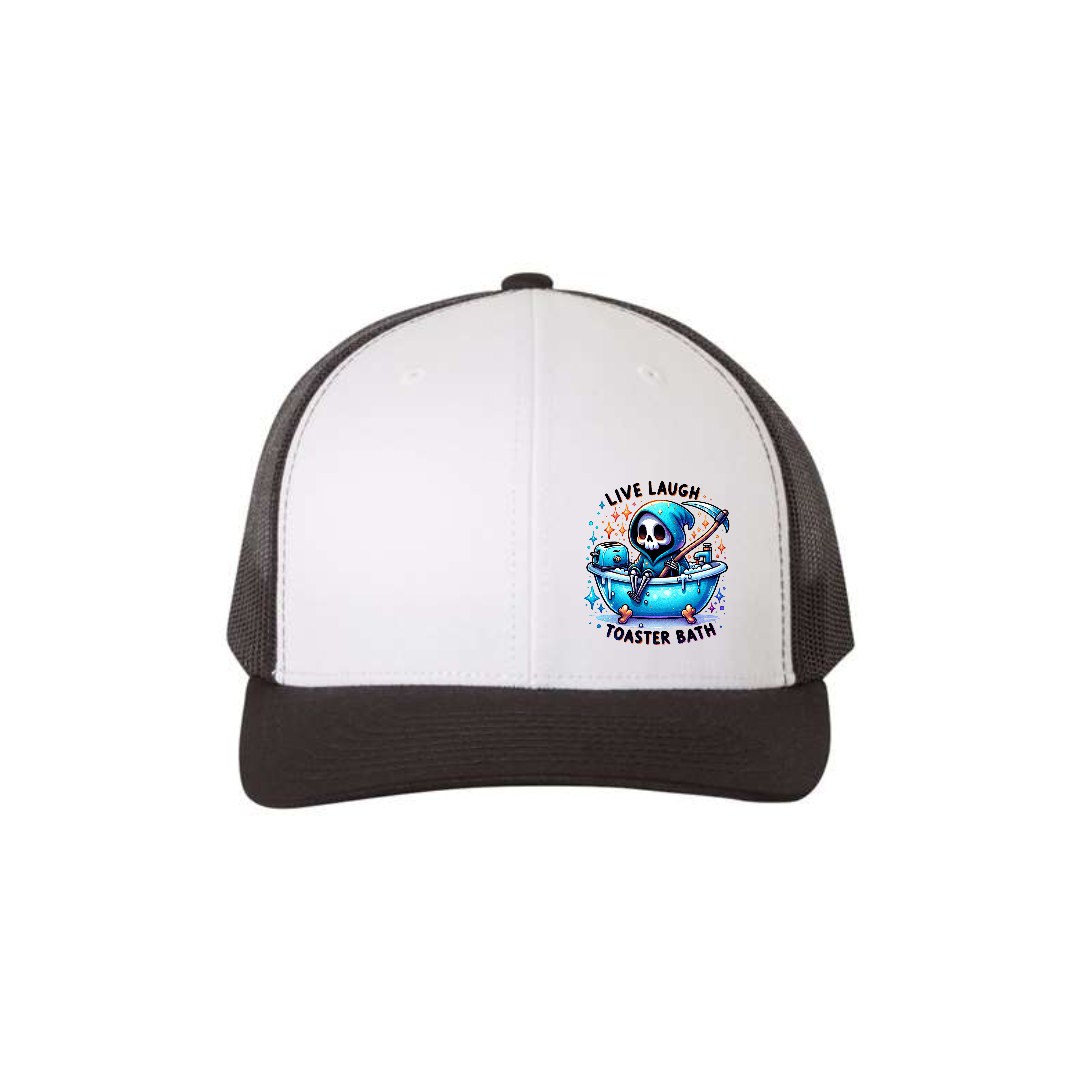 Live, Laugh, Toaster Bath 6-panel trucker hat in white with a black brim and black mesh, front product mockup showing a colourful Grim Reaper bathtub patch.