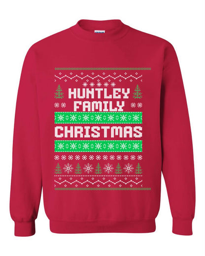 Red personalized Family Christmas crewneck sweater with a family surname, snowflakes and green Christmas trees.