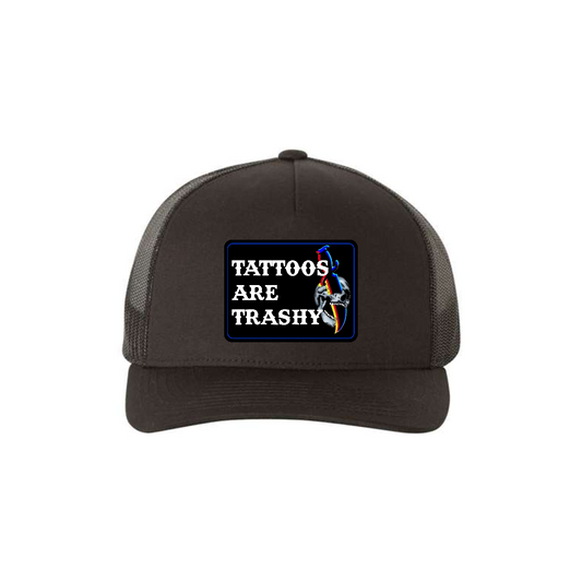 Tattoos Are Trashy Skull Blade 5-panel trucker hat in black, front product mockup showing a black skull and blade design patch.