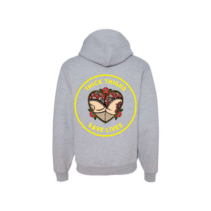 Athletic Heather Thick Thighs Save Lives graphic hoodie, back view showing the yellow circular slogan graphic.