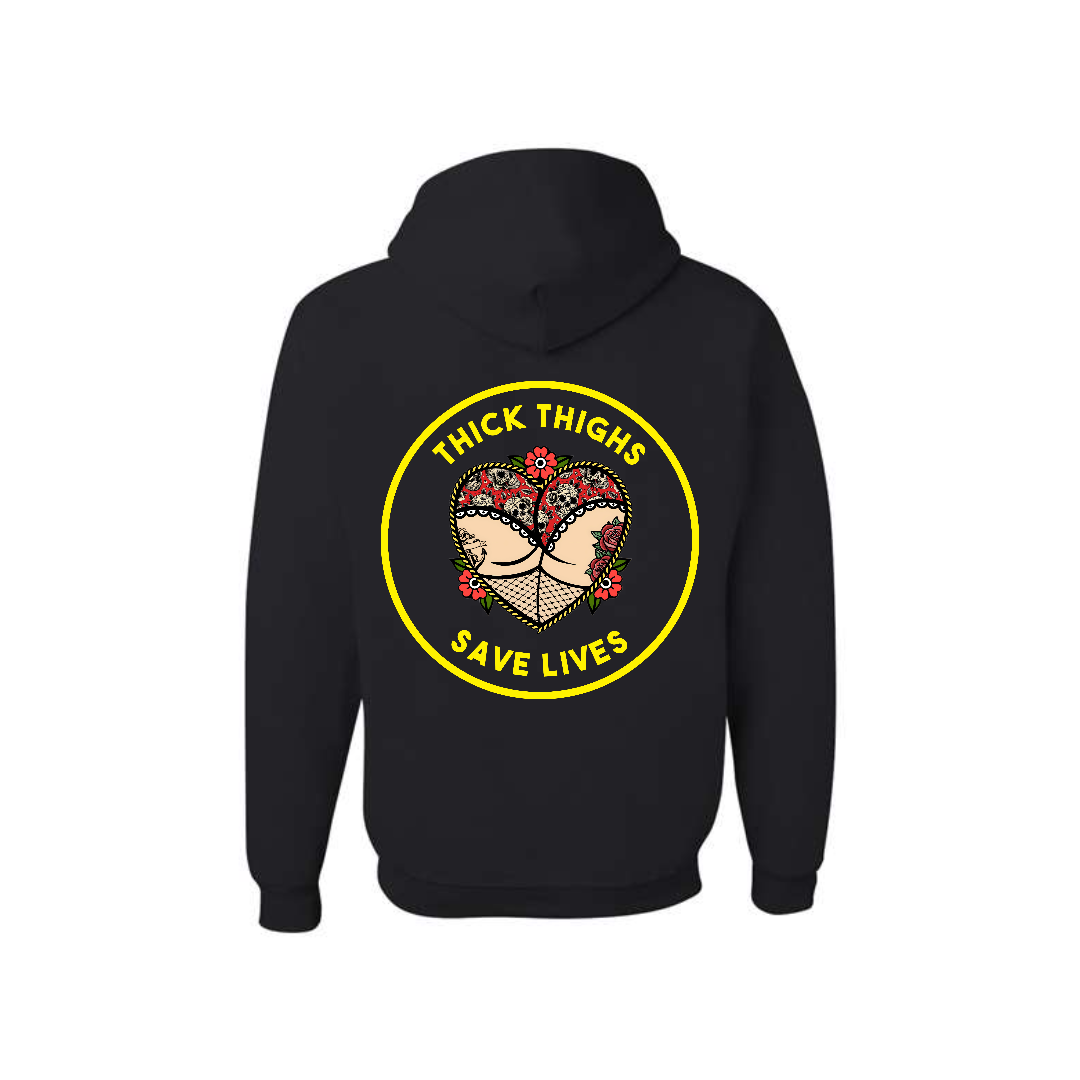 Black Thick Thighs Save Lives graphic hoodie, back view showing the yellow circular slogan graphic.