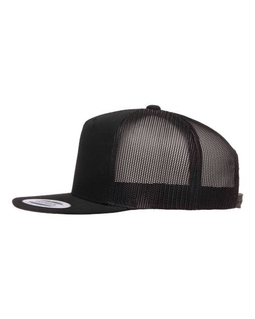 Yupoong 6006 flat brim trucker hat in Black, angled side view.