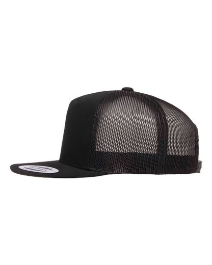 Yupoong 6006 flat brim trucker hat in Black, angled side view.