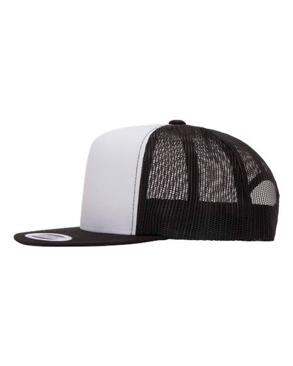 Yupoong 6006 flat brim trucker hat in Black/ White/ Black, angled side view.