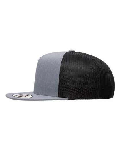 Yupoong 6006 flat brim trucker hat in Heather/ Black, angled side view.
