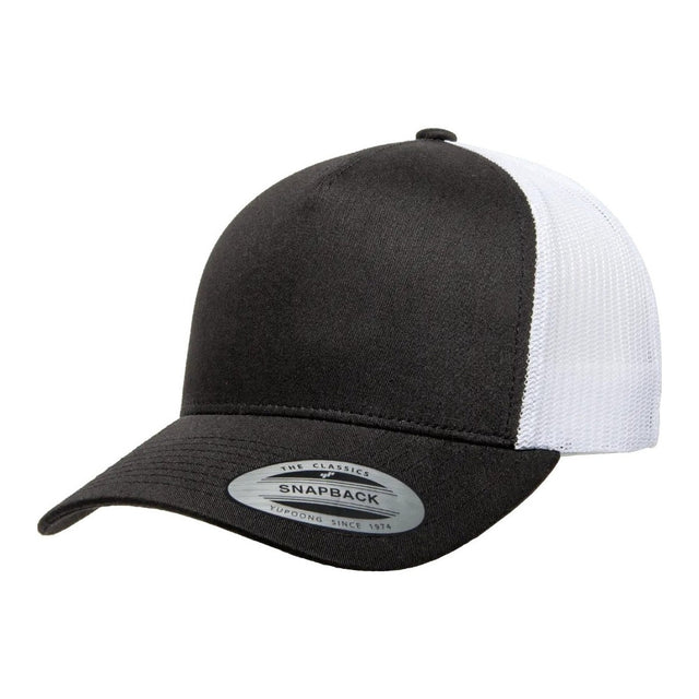 Yupoong 6506 trucker hat in Black / White, angled front view.