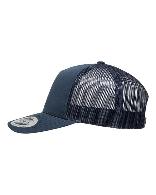 Yupoong 6506 trucker hat in Navy, angled side view.