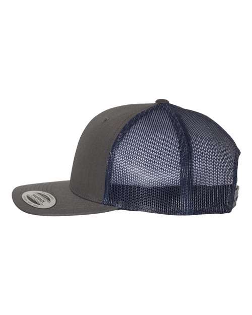 Yupoong 6606 snapback trucker hat in Charcoal/ Navy, angled side view.