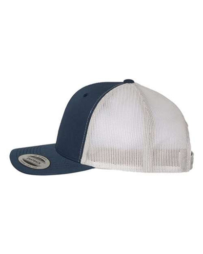 Yupoong 6606 snapback trucker hat in Navy/ Silver, angled side view.