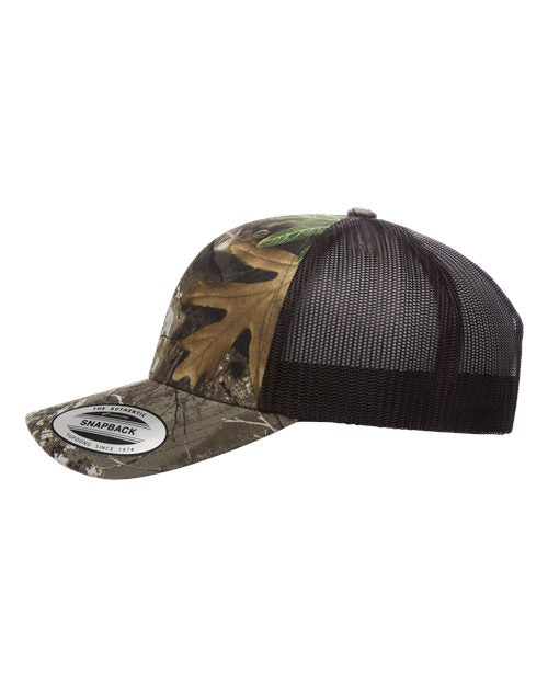 Yupoong 6606 snapback trucker hat in Realtree Edge/ Brown, angled side view.