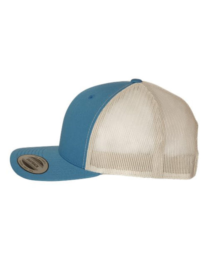 Yupoong 6606 snapback trucker hat in Steel Blue/ Silver, angled side view.