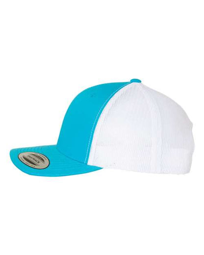 Yupoong 6606 snapback trucker hat in Turquoise/ White, angled side view.